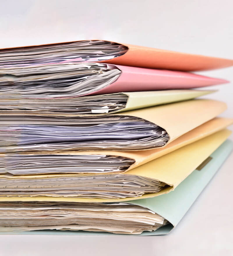 Colourful stack of folders representing business administration